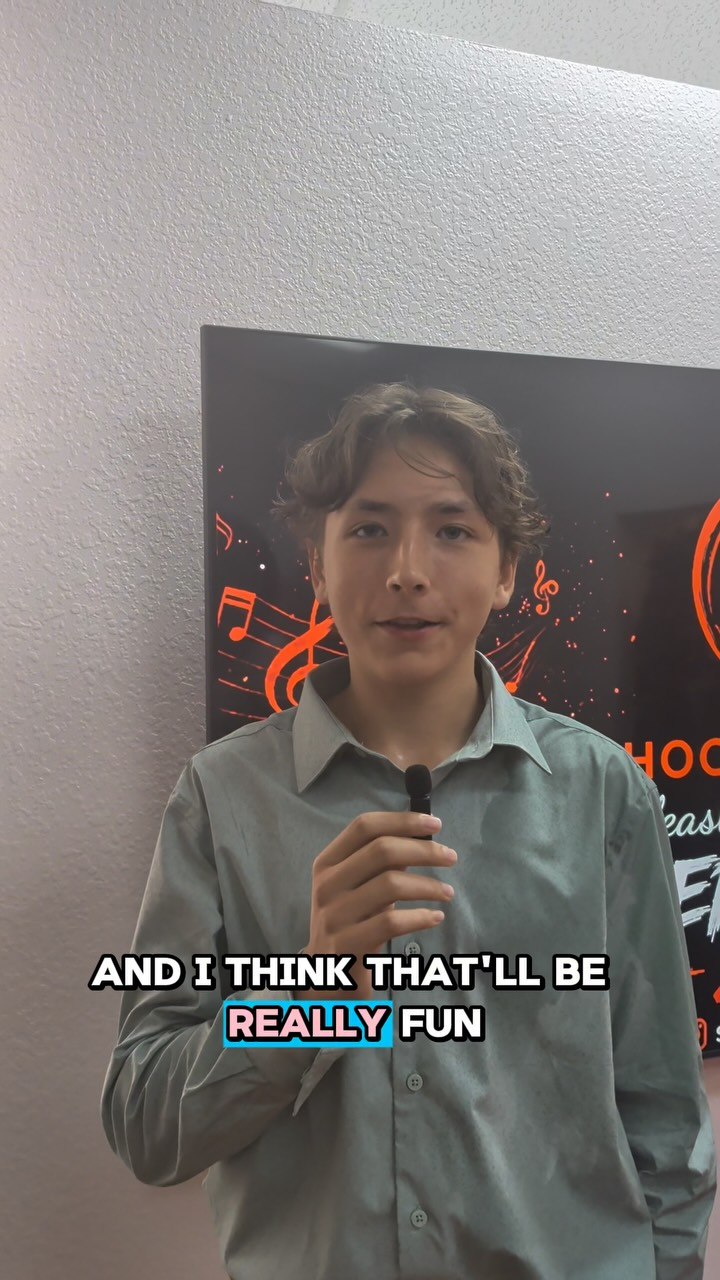 A School of Talent performer speaking in a backstage interview